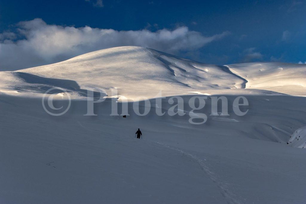 Descending from the Emparis plateau on snowshoes