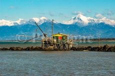 Fisherman's hut in front of the Apuan Alps