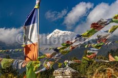 Prayer flags and snowy peak